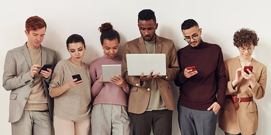 Group of people using electronics