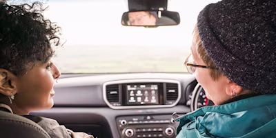 parent and teen in car