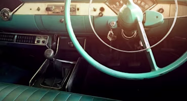 Woman on laptop with MoneySuperMarket logo displayed