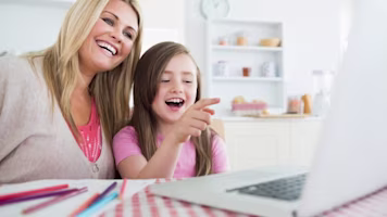 Woman on laptop with MoneySuperMarket logo displayed