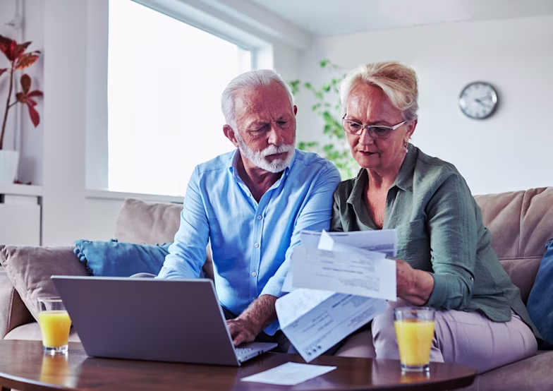 woman with laptop looking at some documents