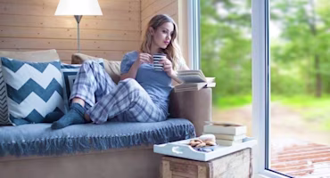 Woman sitting on sofa