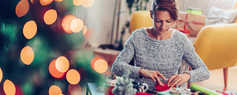 Woman wrapping Christmas presents
