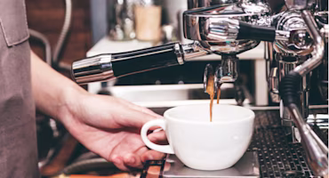 Woman on laptop with MoneySuperMarket logo displayed