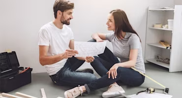 Woman on laptop with MoneySuperMarket logo displayed