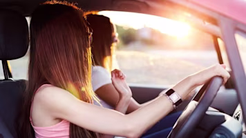 Woman on laptop with MoneySuperMarket logo displayed