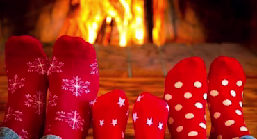 Woman on laptop with MoneySuperMarket logo displayed