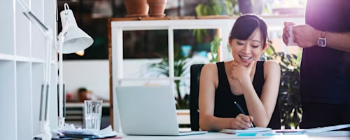 Woman smiling with laptop