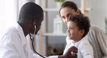 Woman on laptop with MoneySuperMarket logo displayed