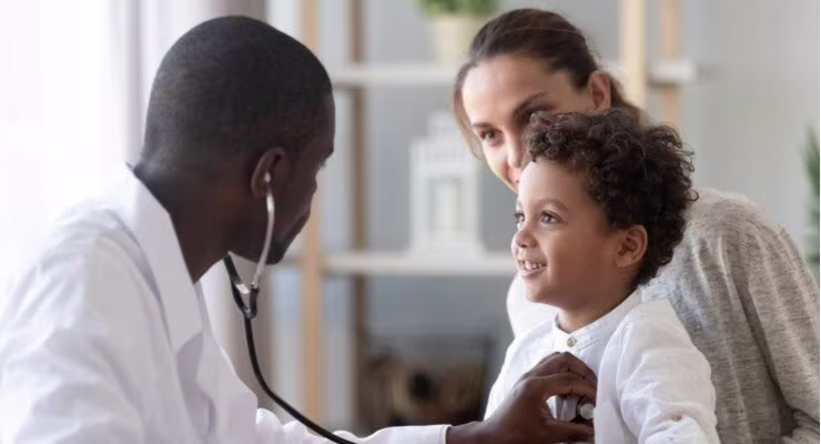Doctor with mother and child