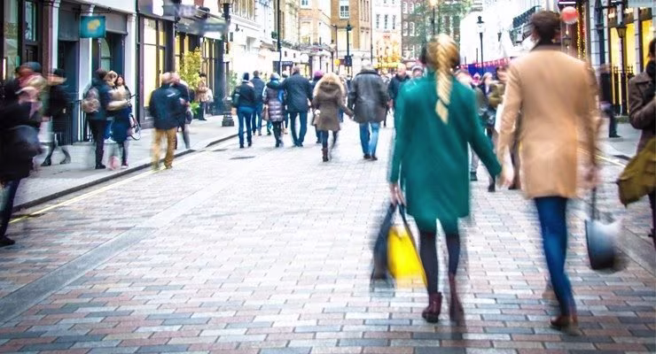 Couple walking on busy shopping street