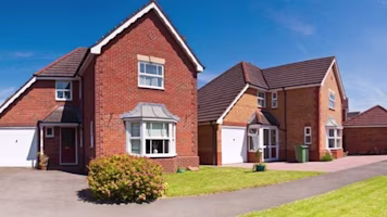 Woman on laptop with MoneySuperMarket logo displayed