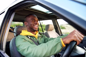 man driving car