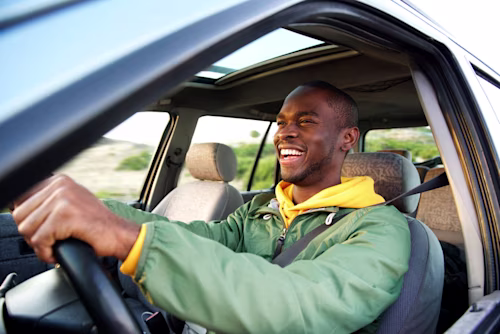 Young man driving a car