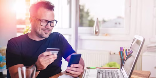 Man with laptop and credit card