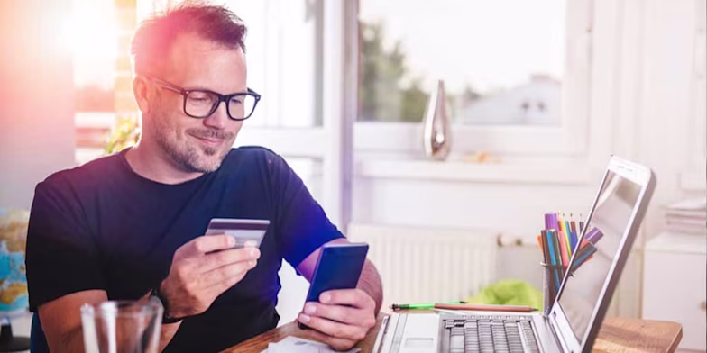 Man with laptop and credit card