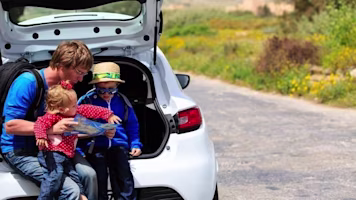 Woman on laptop with MoneySuperMarket logo displayed