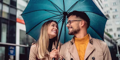 Woman on laptop with MoneySuperMarket logo displayed