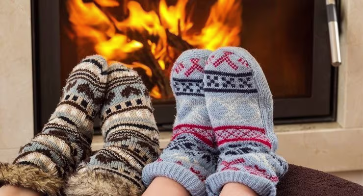 Feet being warmed by fire