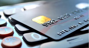 Woman on laptop with MoneySuperMarket logo displayed