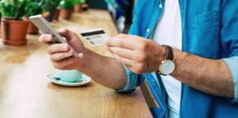 man using laptop to check his credit card statement-mob