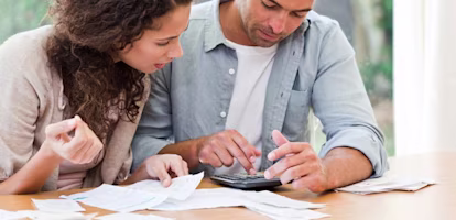 Woman on laptop with MoneySuperMarket logo displayed