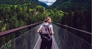 Woman on laptop with MoneySuperMarket logo displayed