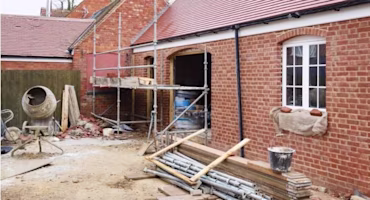 Woman on laptop with MoneySuperMarket logo displayed