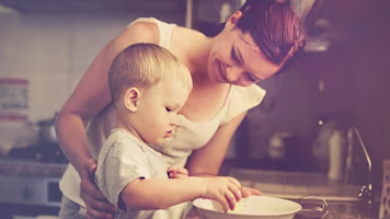 Woman on laptop with MoneySuperMarket logo displayed