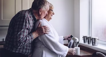 Woman on laptop with MoneySuperMarket logo displayed