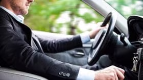 man driving car