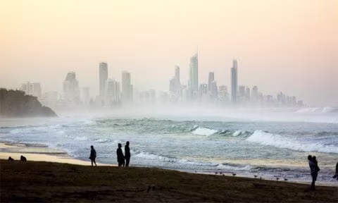 Beach at sunset with cityscape background - Gold Goast, Australia 