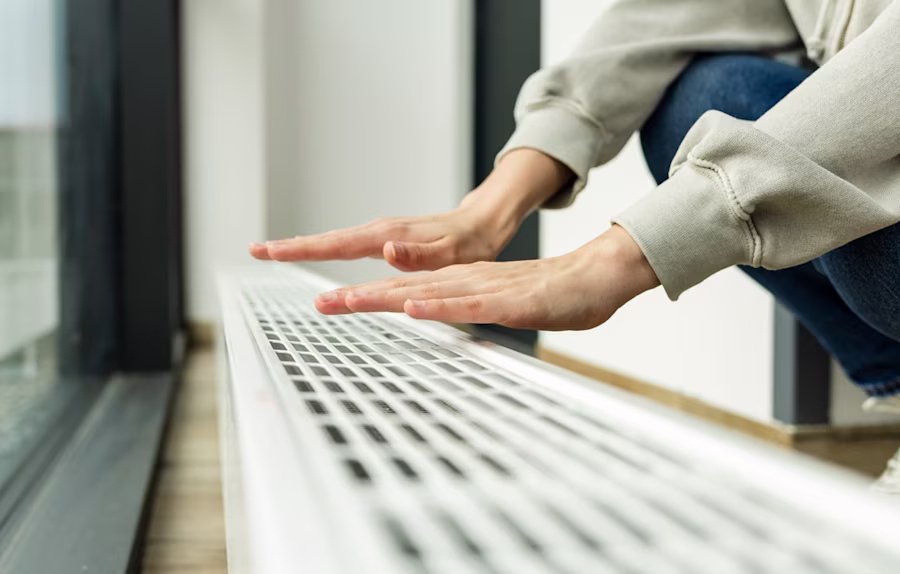 hands over radiator