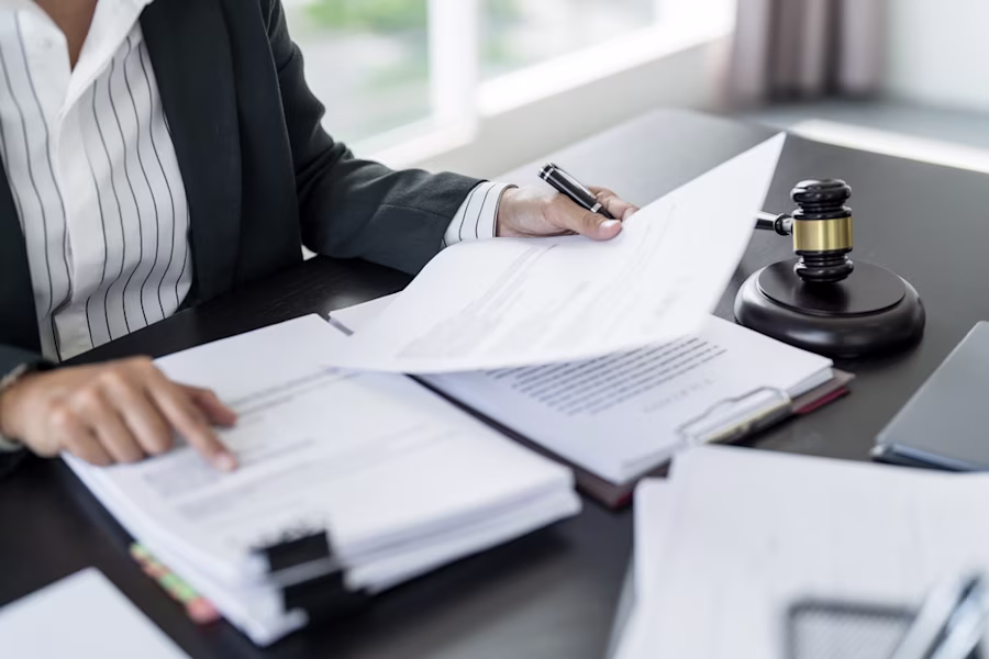 woman looking through paperwork 