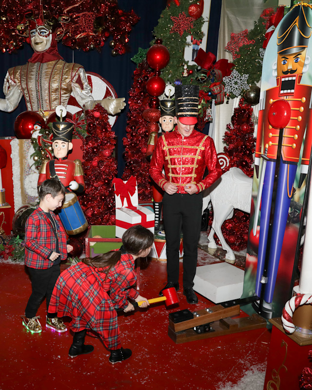 Passport to Santa guests in a festive red holiday set with a toy soldier