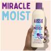 A picture of Miracle Moist shampoo Bottle held in hand, with a text: miracle moist.