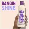 A picture of bangin shine shampoo Bottle in hand and claim: bangin shine.