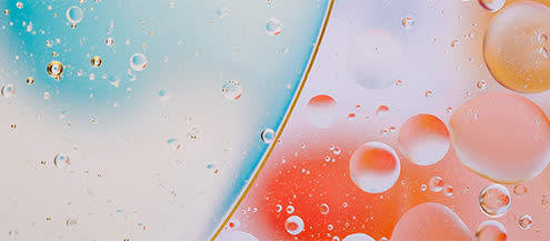 Picture of closed up water drops put on glass and colorful background