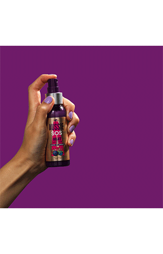A gif of a hand spraying Aussie product on a purple background