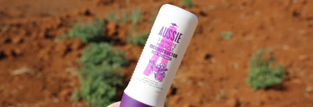 A close up photo of Aussie product on the desert background