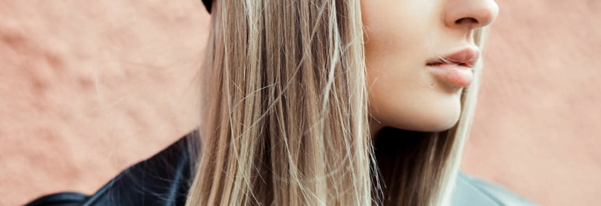 A photo of half of woman's face who has long blonde straight hair
