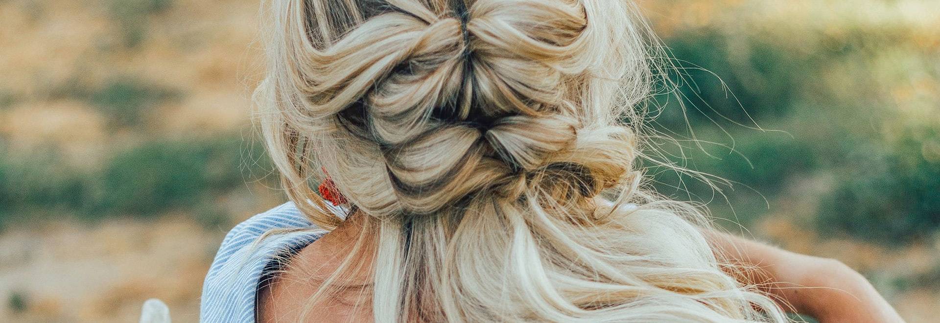A close up photo of blonde braid