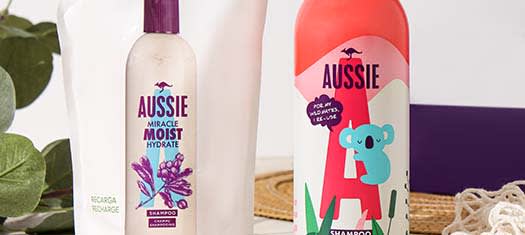 A picture of Aussie Aluminium Shampoo bottle and a refill package standing in bathroom environment