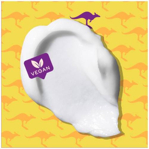 A picture of splash of conditioner and badge saying vegan.