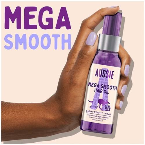 A picture of Mega Smooth hair oil bottle in hand and claim: mega smooth.