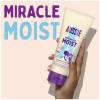 A picture of Miracle Moist conditioner tube held in hand, with a text: miracle moist.