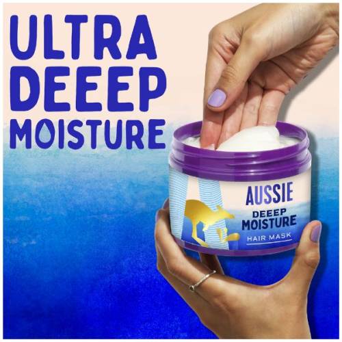 A picture of a hair mask held in hand with a text above: ultra deep moisture.