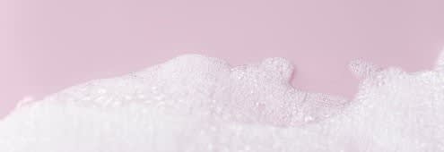 A picture of a foam on pink surface