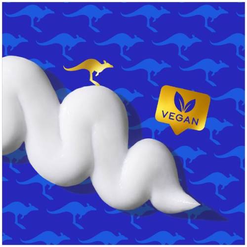 A picture of splash of conditioner and badge saying vegan. 