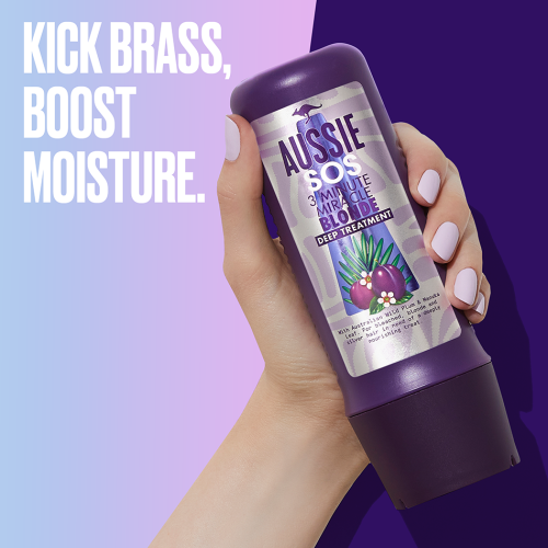 An image of a hand holding Aussie SOS 3 Minute Miracle Blonde Hair Deep Treatment and a sentence: 'Kick brass, boost moisture'
